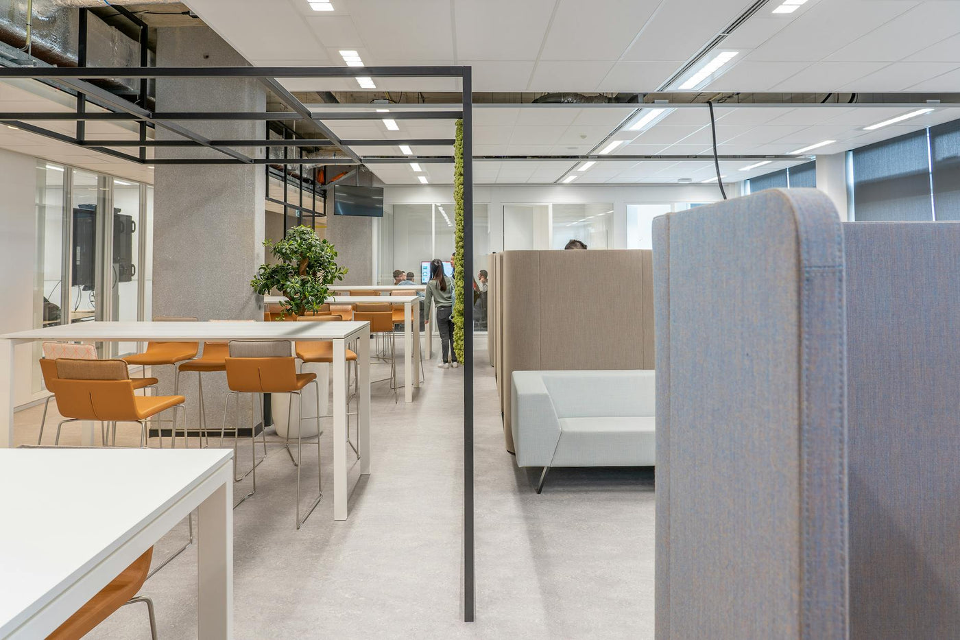 A sleek, contemporary office space featuring minimalist design and open layout with modern furniture.