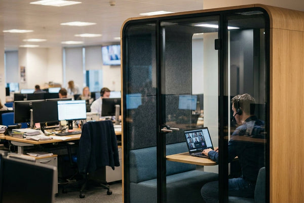 Soundproof pod for private video calls in a newsroom