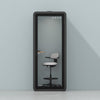 Quell Acoustic Plus Soundproof pod in black, light blue background, light office workspace