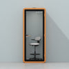 Quell Acoustic Plus Soundproof pod in orange, light blue background, light office workspace